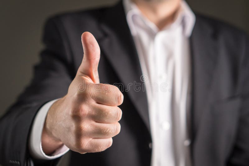 Showing thumbs up. stock images