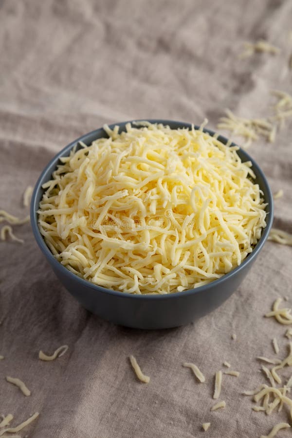 Shredded Mozzarella Cheese In A Bowl Side View Stock Photo Image Of shredded-mozzarella-cheese-in-a-bowl-side-view-stock-photo-image-of