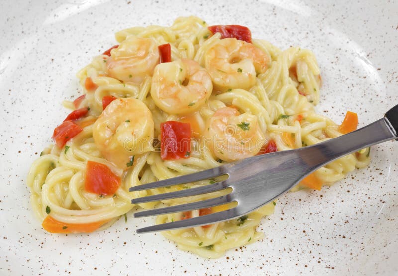 Shrimp and angel hair pasta with fork
