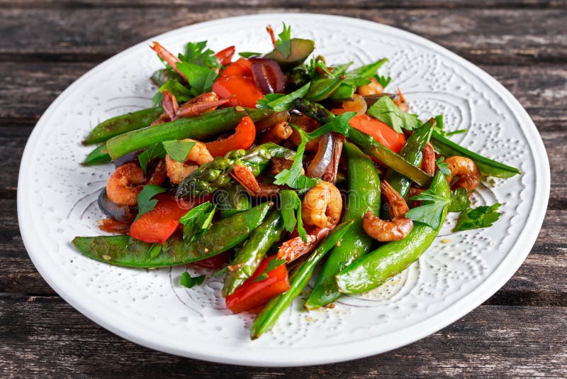 Shrimp and Asparagus stir fry food on white plate stock image Shrimp and Asparagus stir fry food on white plate stock image