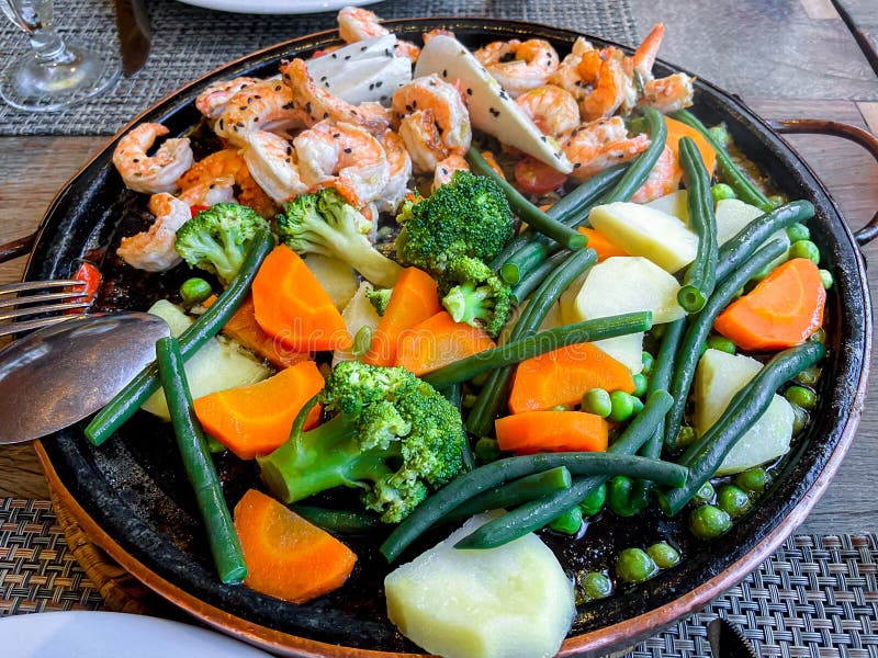 Shrimp Grilled in Fine Herb Butter, with Sauteed Vegetables Stock Image Image of plate, mixed