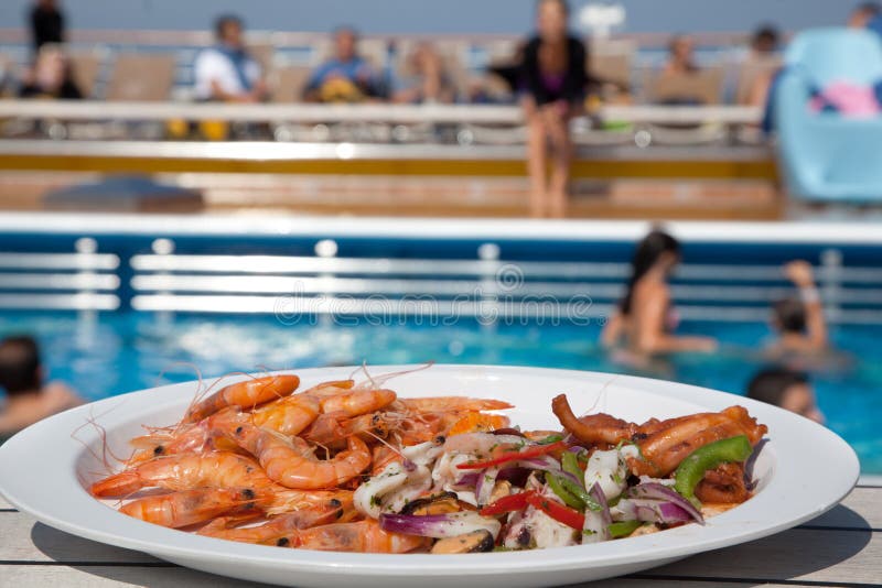 Shrimp salad in plate on deck of ship