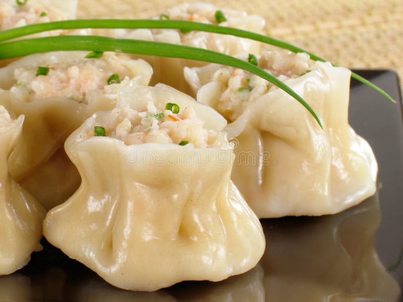 A plate of steamed shrimp siu mai.