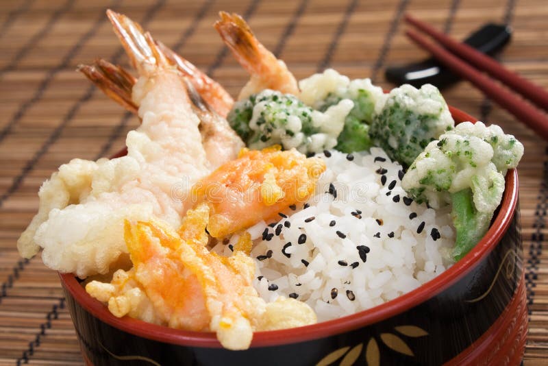 Japanese tendon - lightly battered tempura shrimp, broccoli, and carrots served over rice. Japanese tendon - lightly battered tempura shrimp, broccoli, and carrots served over rice.