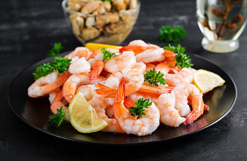 Shrimps, Prawns on Black Plate Stock Image - Image of food, lemon ...