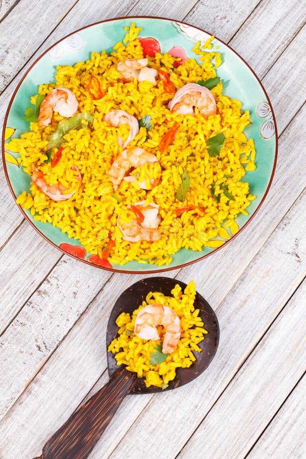 Shrimps Risotto garnished with fresh parsley and red chili pepper