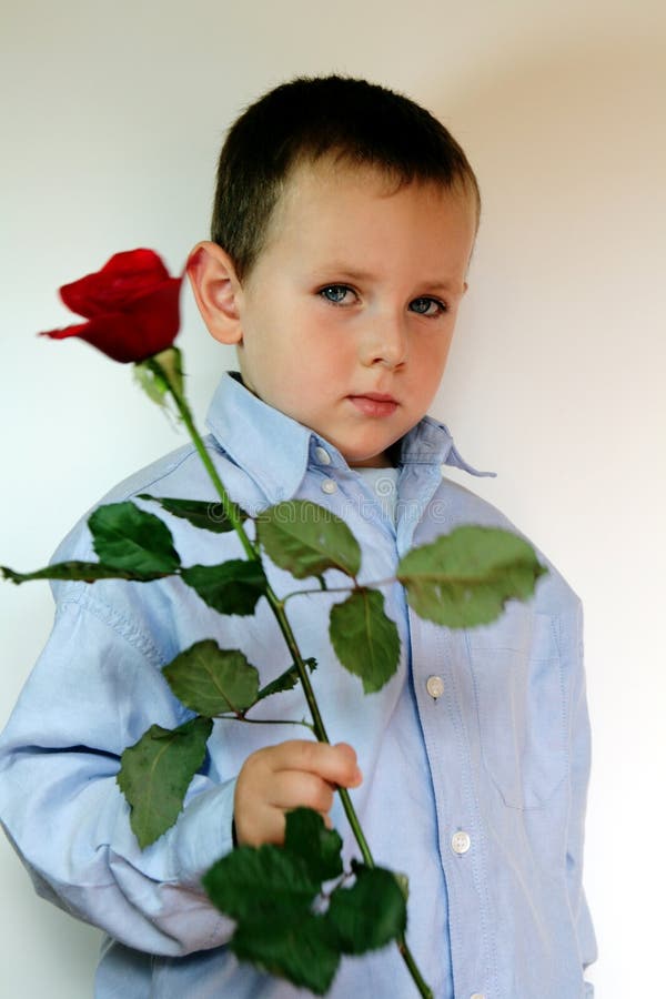 shy boy giving flowers