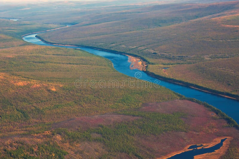 Siberian taiga and the river Tunguska fall from a helicopter