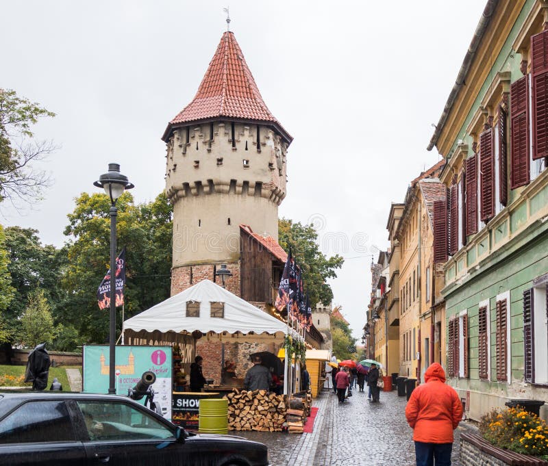 The famous Tower of the Carpenters - Turnul Dulgherilor - on the Cetatii street in a rainy day. Sibiu city in Romania royalty free stock photo The famous Tower of the Carpenters - Turnul Dulgherilor - on the Cetatii street in a rainy day. Sibiu city in Romania royalty free stock photo