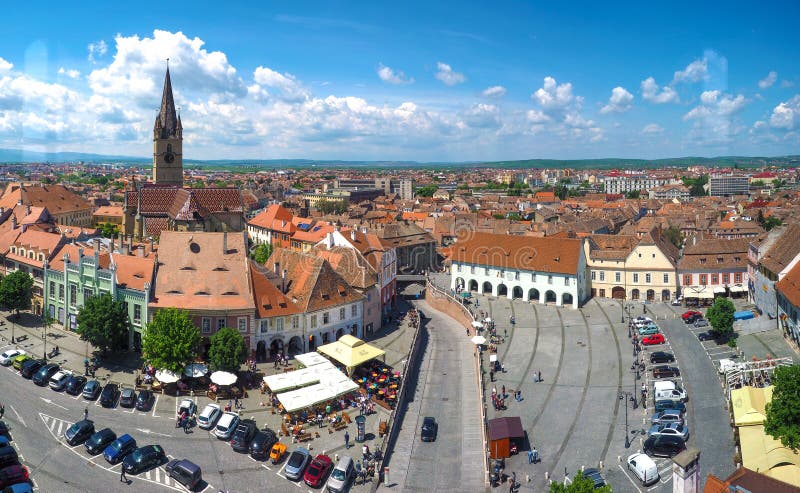 Sibiu skyline, Transylvania, Romania. Panoramic view of the Small Square (Piata Mica) with the old Catholic Cathedral and stock photography Sibiu skyline, Transylvania, Romania. Panoramic view of the Small Square (Piata Mica) with the old Catholic Cathedral and stock photography