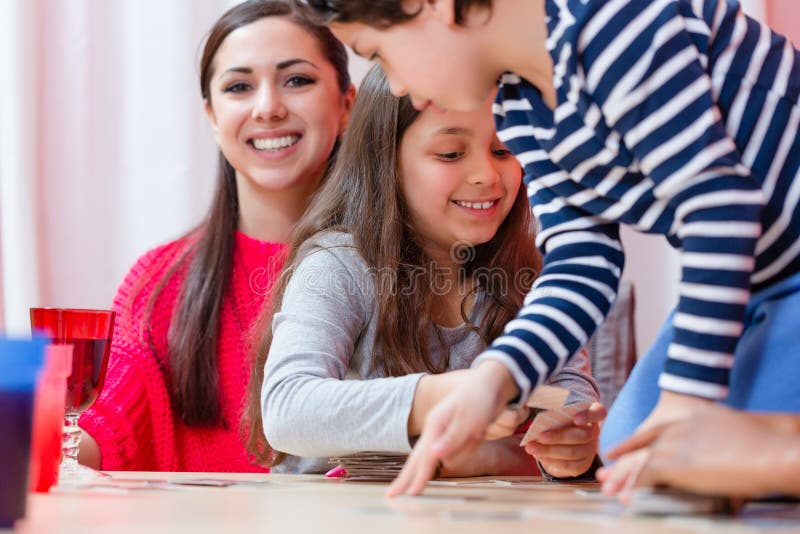 Sibling playing cards at hom royalty free stock photos Sibling playing cards at hom royalty free stock photos