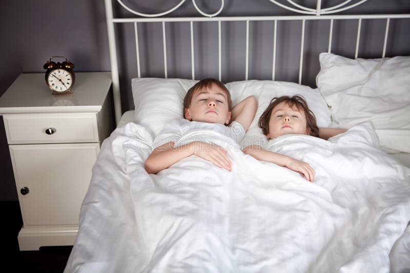 Young Sister On Parents Bed