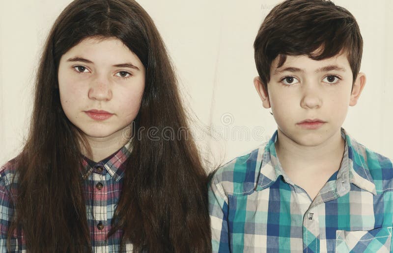 Siblings preteen boy and teenager girl