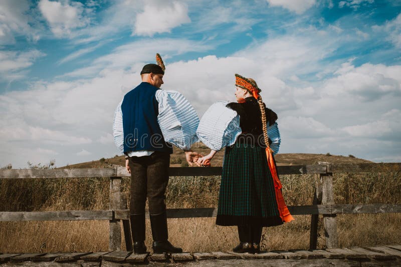 Sic Transilvania Romania 09.08.2018 Bride and groom in traditional suit on their wedding day jumping royalty free stock photos Sic Transilvania Romania 09.08.2018 Bride and groom in traditional suit on their wedding day jumping royalty free stock photos