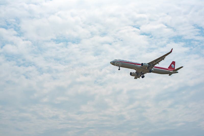 Sichuan Airlines Airbus A321 commercial airplane against sky stock images Sichuan Airlines Airbus A321 commercial airplane against sky stock images
