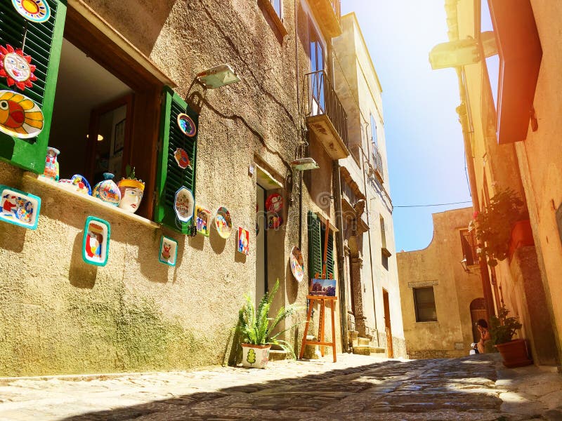 Sicilian souvenirs. Ancient, typical narrow and cobblestone street in Erice, Sicily, Italy. royalty free stock photos Sicilian souvenirs. Ancient, typical narrow and cobblestone street in Erice, Sicily, Italy. royalty free stock photos