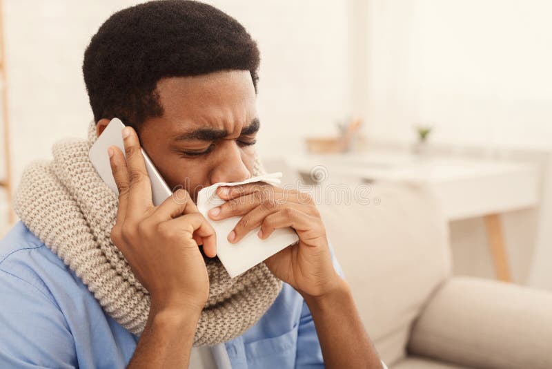 Sick black man calling on phone. to doctor stock photos Sick black man calling on phone. to doctor stock photos
