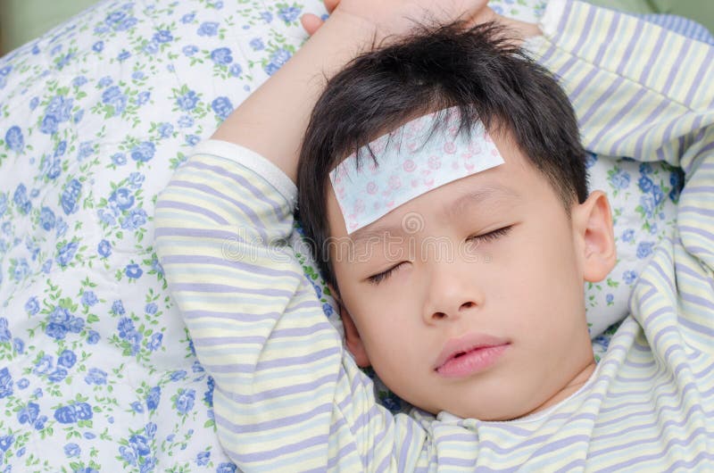 Sick boy lying on bed stock image. Image of unwell, face 64059545