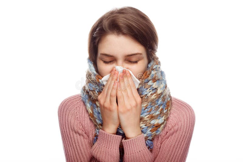 Sick Female Sneezing On White Background Stock Photo