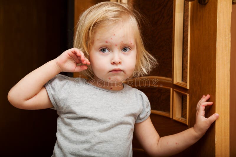 A sick girl is near the door royalty free stock photo A sick girl is near the door royalty free stock photo