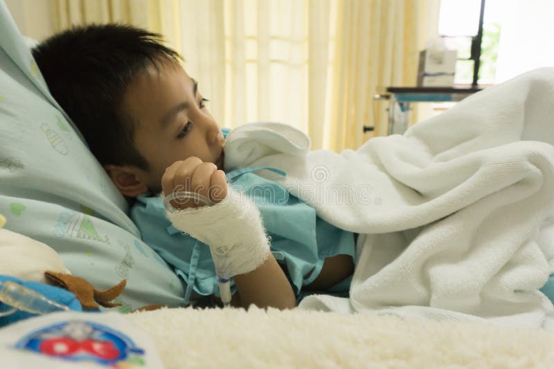 A Sick Little Boy in Hospital Bed. Stock Image Image of lying