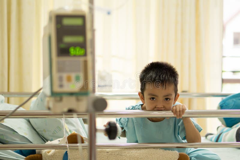 A Sick Little Boy in Hospital Bed. Stock Image Image of lying