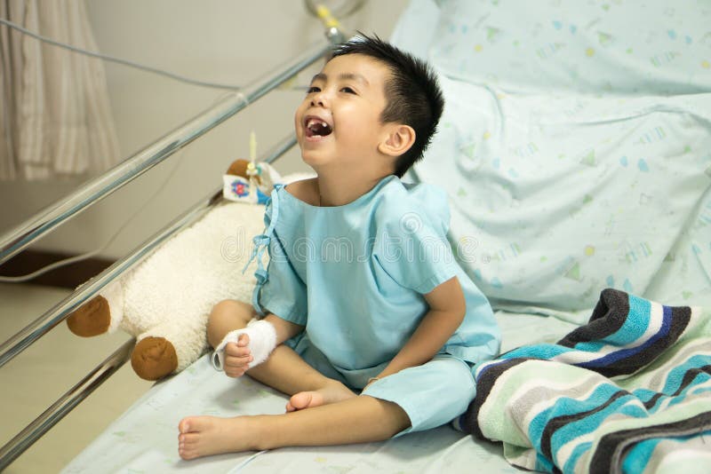 A Sick Little Boy in Hospital Bed. Stock Image Image of hand, illness