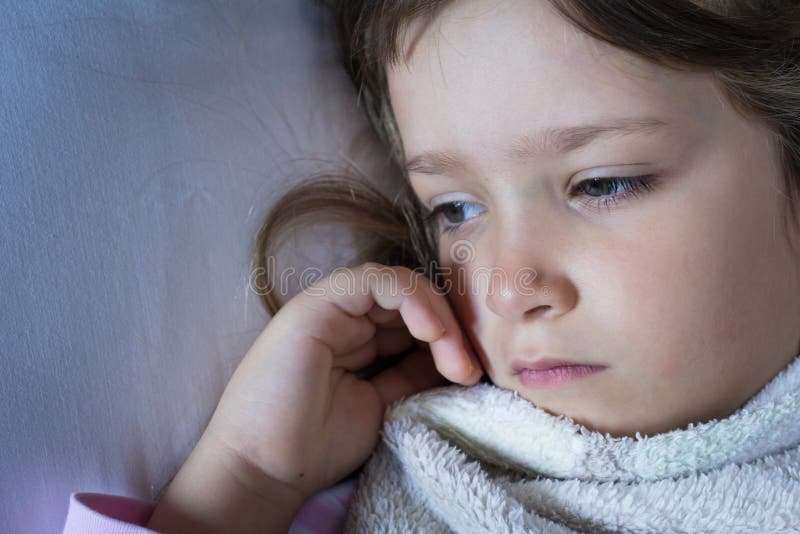 Im Sick And Tired Of My Childhood Sick and Tired Child Wrapped with Blanket Lying in Bed. Close Up