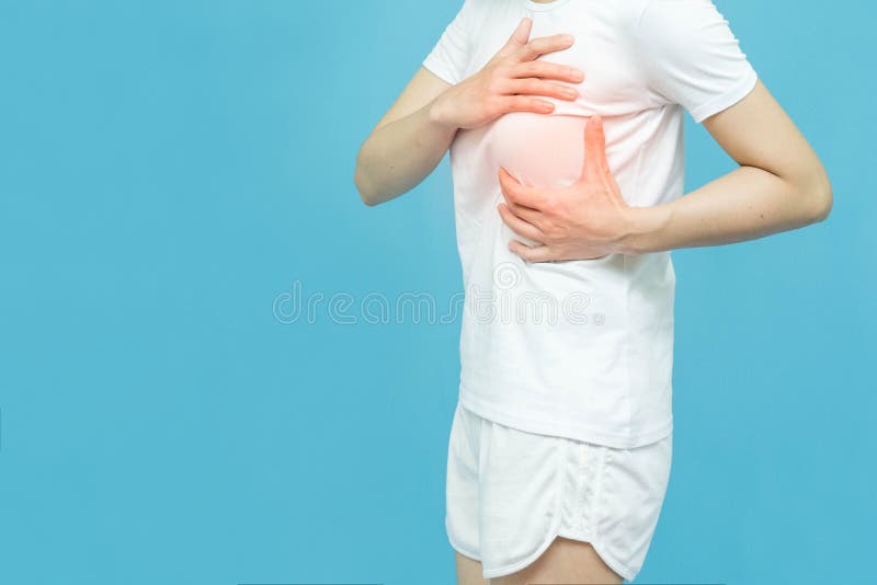 The side body of the woman put her hands on the chest area mark red at spot of ache,Breast cancer concept isolated on white. Background royalty free stock photography The side body of the woman put her hands on the chest area mark red at spot of ache,Breast cancer concept isolated on white. Background royalty free stock photography