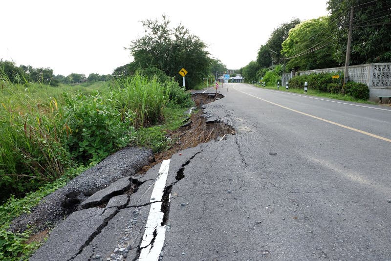 Side of the Broken Asphalt Road Collapsed and Fallen after Flood Stock