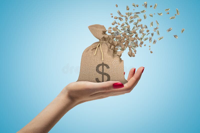 Side closeup of woman`s hand facing up and holding canvas money bag that is dissolving in pieces on light blue