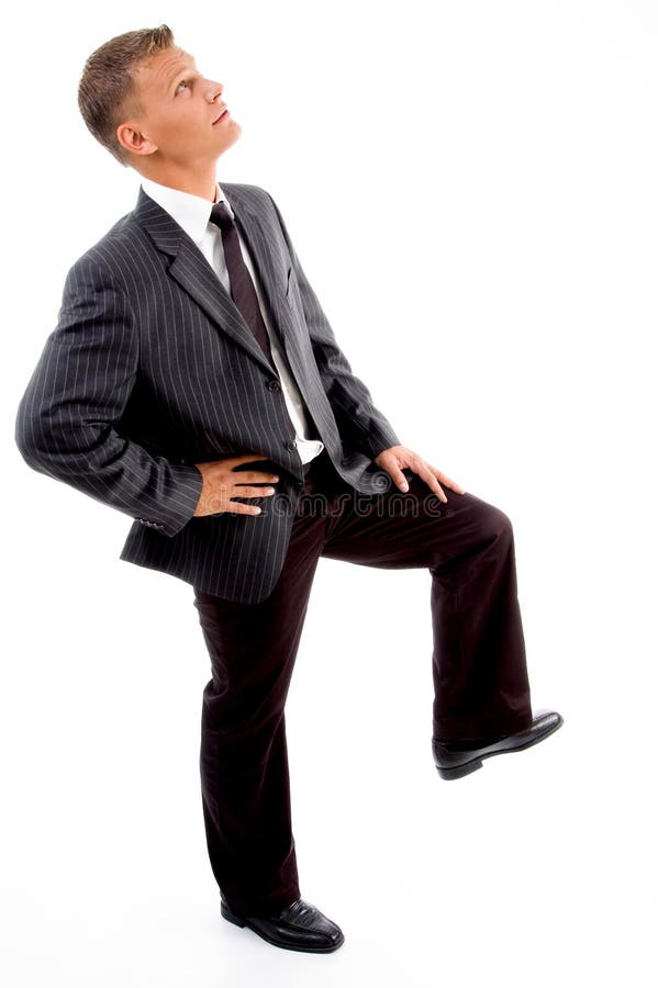 Side pose of businessman looking upward