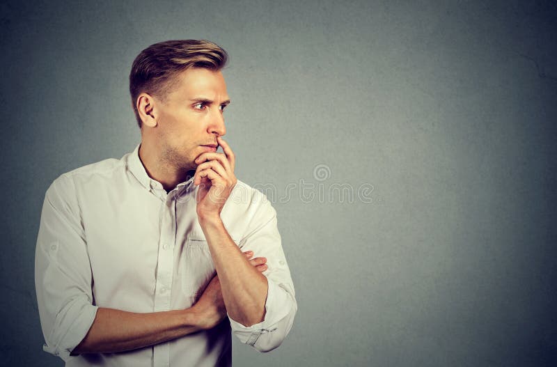 Side profile preoccupied anxious young man