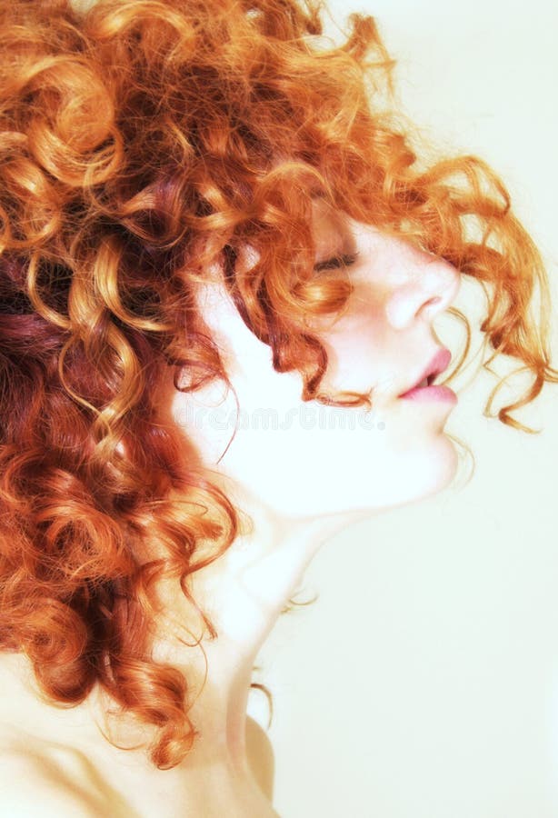 Side Profile Of Woman With Curly Red Hair Stock Photo 