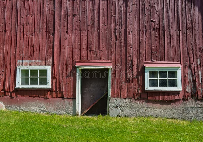 Side of red barn with windows