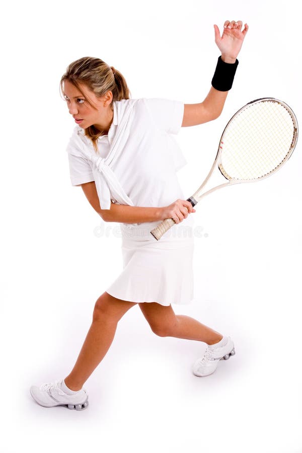 Side view of adult tennis player playing tennis