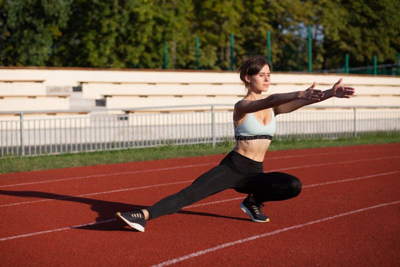 Fit Woman Warms Up before Run Stock Image - Image of concentration ...