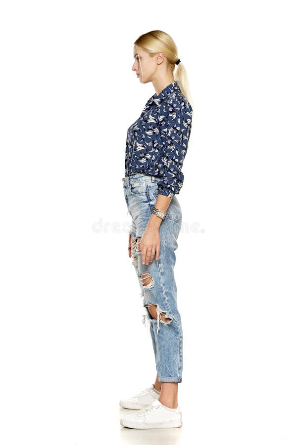 Side View of a Beautiful Young Woman in Ripped Jeans Stock Image ...
