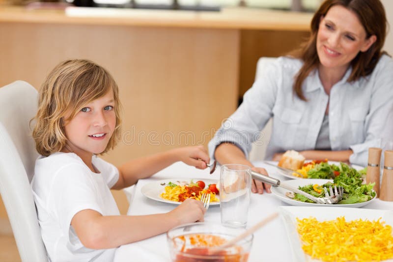Side View of Boy Sitting at the Dinner Table Stock Image Image of