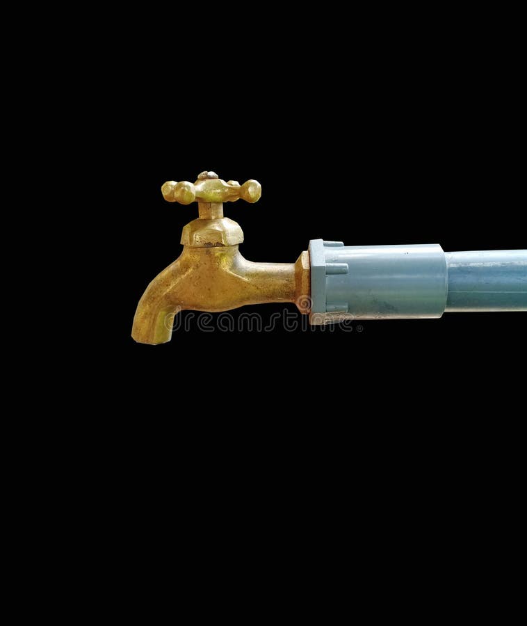 A brass water faucet isolated on black background.
