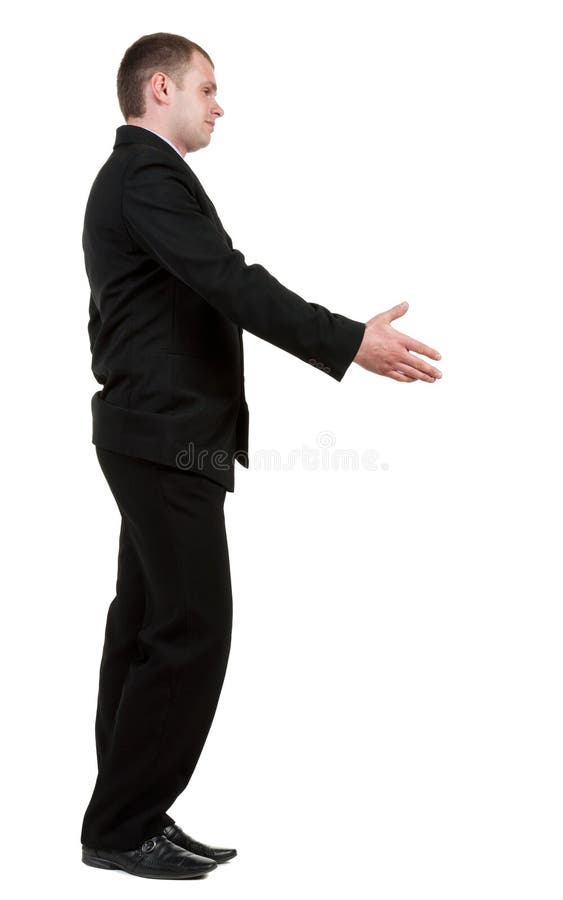 Side view of businessman in black suit handshake. royalty free stock image