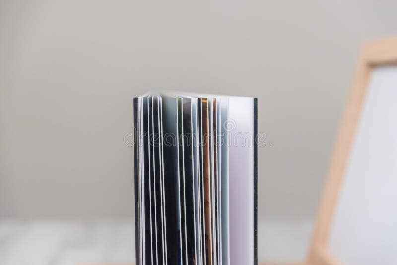 Side View Close Up of Thick and Rigid Wedding Album Pages in a Book