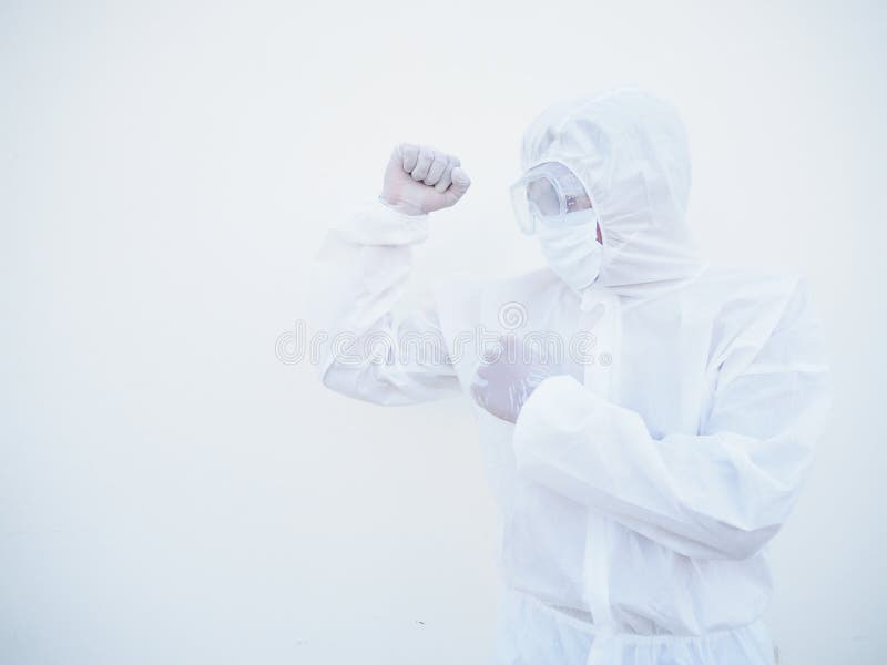 Side view doctor or scientist in PPE suite uniform standing with raised fists like boxer for fight with coronavirus or COVID-19 royalty free stock images