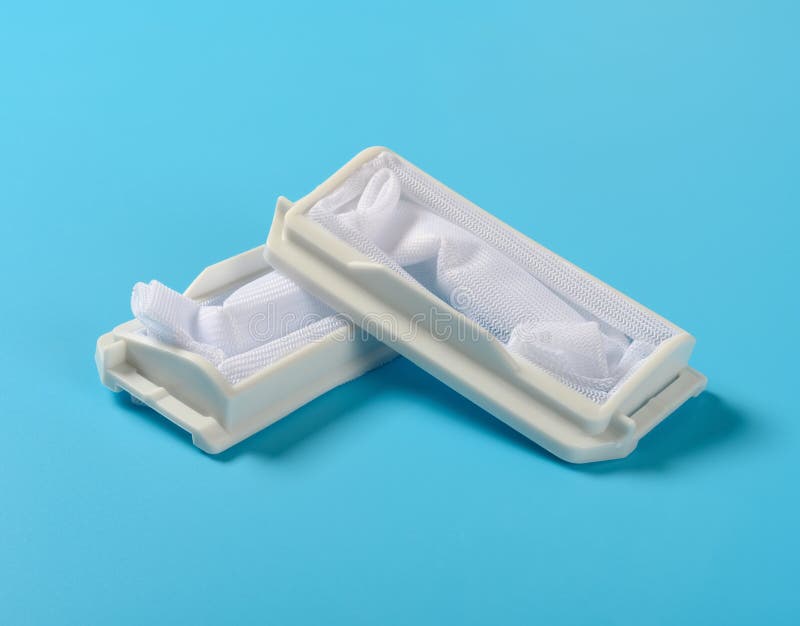 Dust collectors for washing machine on blue background stock photo