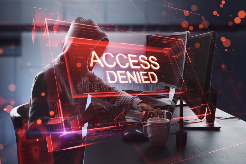 Side view of hacker using computers at desktop with abstract red denied access hologram on blurry office interior background. stock image