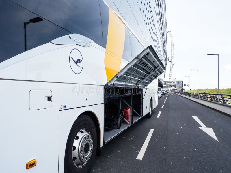 Side view of Lufthansa Setra Express bus coach with open luggage door