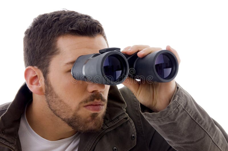 Side view of man looking through binoculars