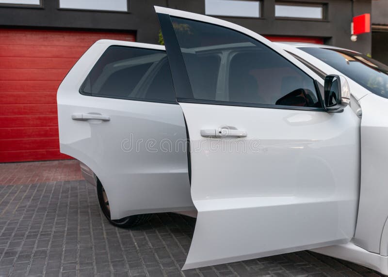 Side View of New White Modern Car with Open Doors. Luxury Expensive Car