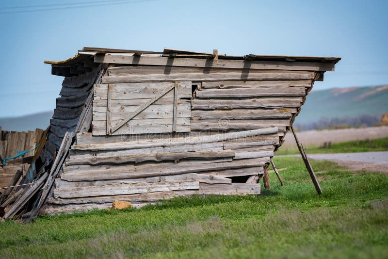 Old leaning farm shed stock photo. Image of country