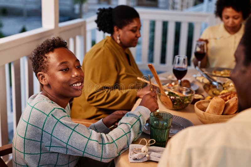 Black Family Enjoying Dinner Together on Terrace Stock Image - Image of